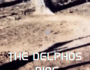 A blurred, desolate landscape with "THE DELPHOS RING" text overlaid.