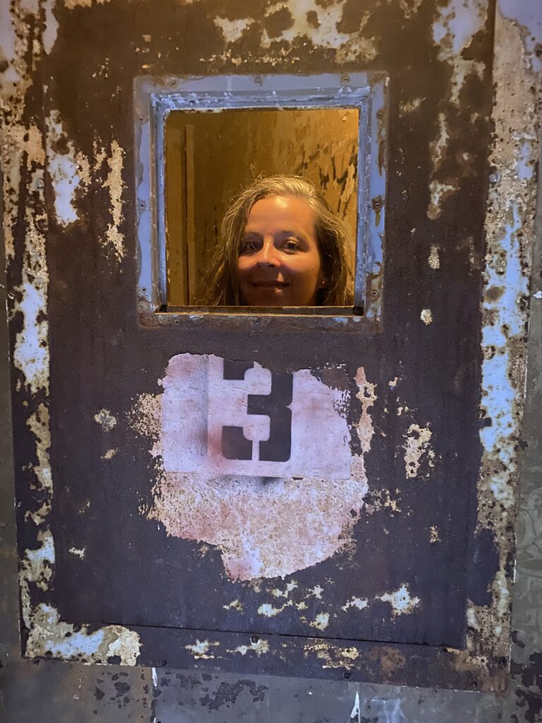 Jennifer Jones peering through a cell door at Waverly Hills Sanatorium