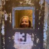 Jennifer Jones peering through a cell door at Waverly Hills Sanatorium